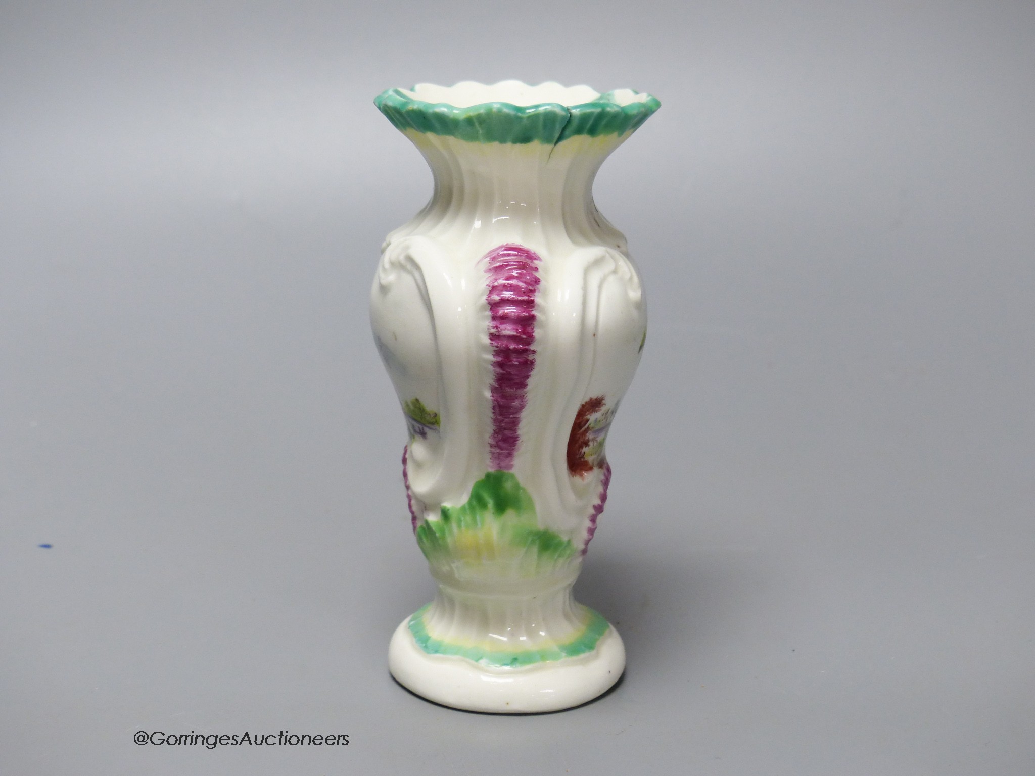 An 18th century Derby asymmetric vase painted with two landscapes, height 12.5cm